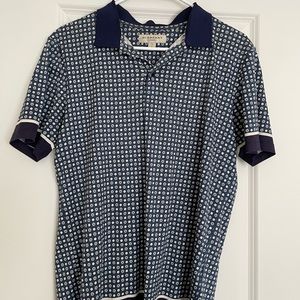 Men’s Burberry blue patterned polo.
